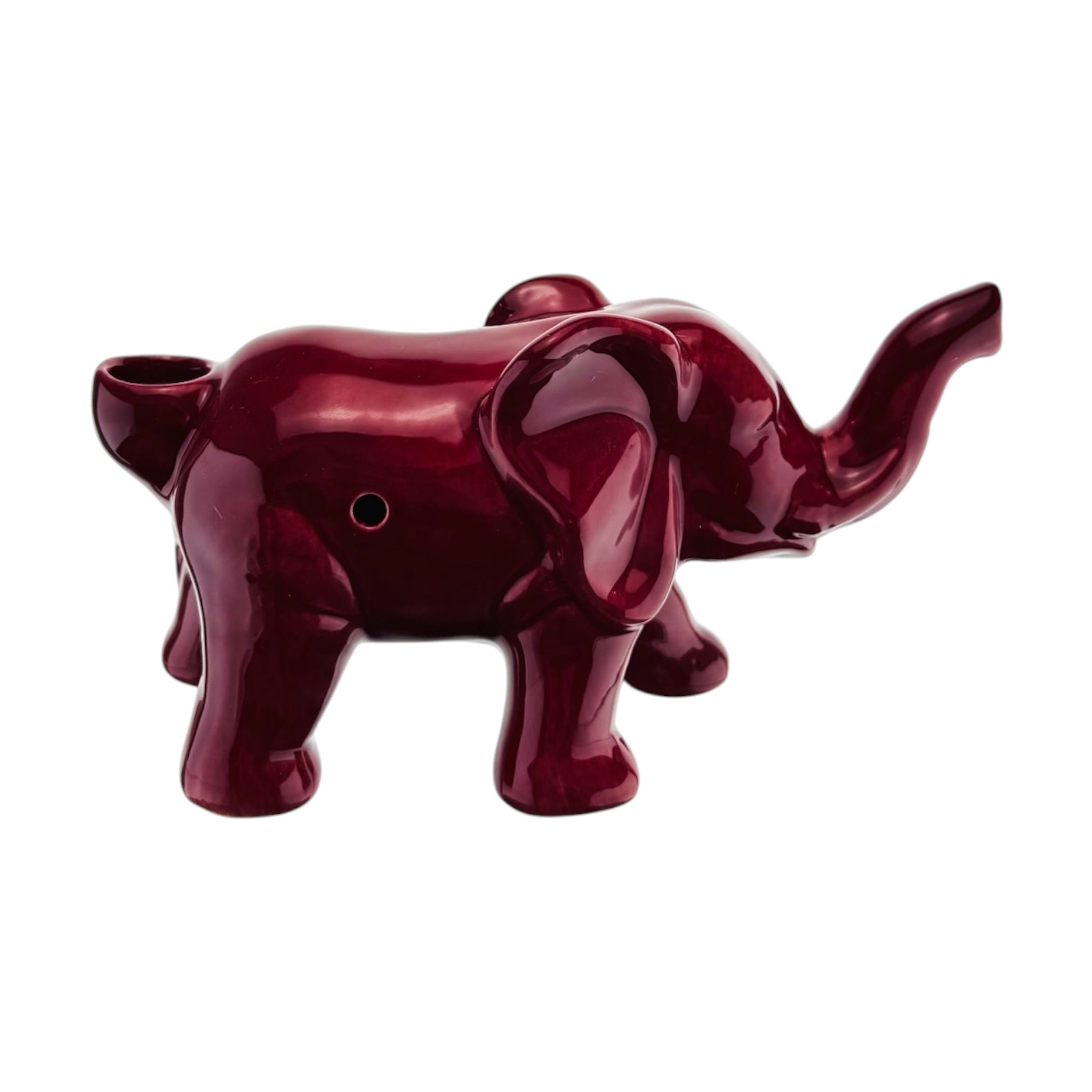 A glossy, dark red elephant-shaped ceramic pot or diffuser with a small circular hole on its side, shown against a plain white background.