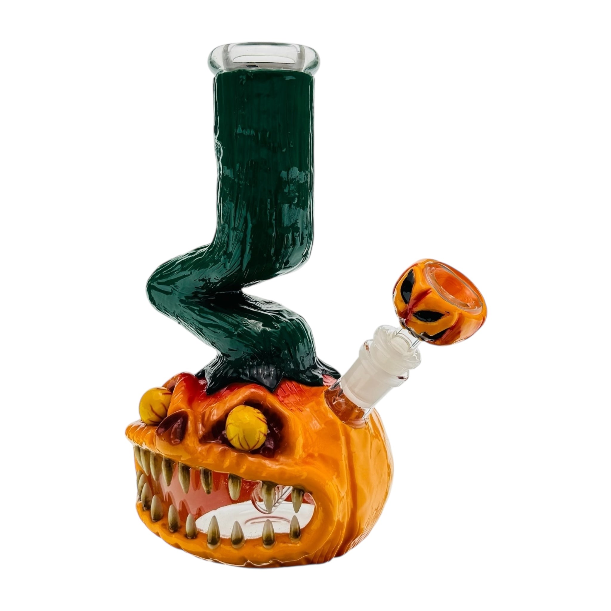 Glass smoking accessory shaped like a pumpkin with a witch's leg on a white background