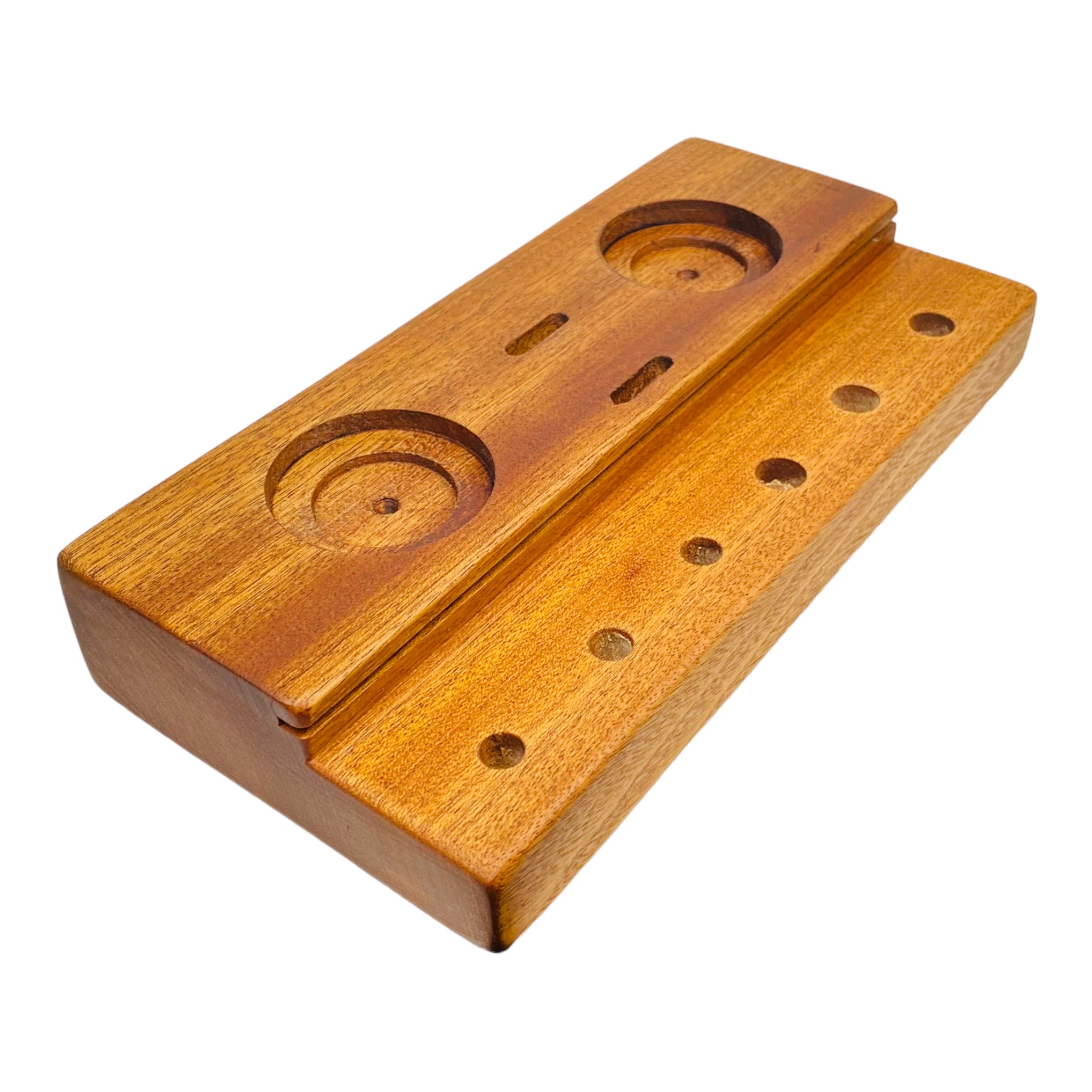 This Multi Hole Wood Dab Station And Display Stand Holder is made from premium mahogany and features two different sized holes for jars, two slots to hold Q Tips, and three 10mm and 14mm holes to hold various bong bowl pieces or quartz bangers. A perfect storage solution for the dab connoisseur.